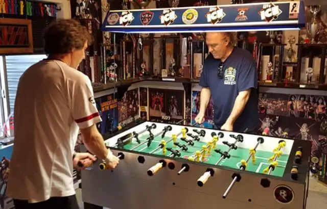 How do you hold a foosball handle